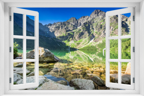 Fototapeta Naklejka Na Ścianę Okno 3D - Green lake in the mountains at sunrise, Poland