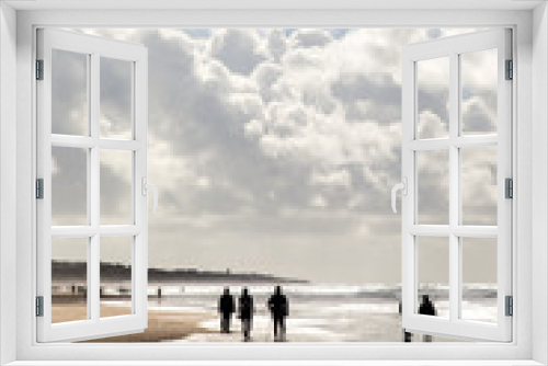 Fototapeta Naklejka Na Ścianę Okno 3D - People in the beach under a beautiful cloudy sky