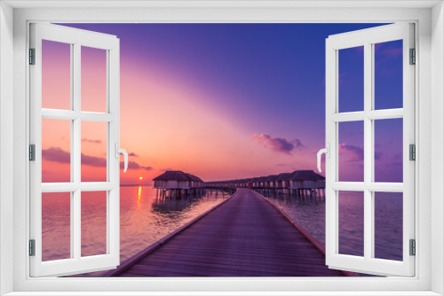 Fototapeta Naklejka Na Ścianę Okno 3D - Luxury summer vacation background. Sunset over Luxury Maldives water villas