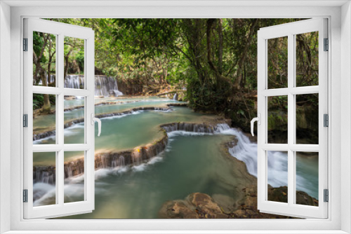 Fototapeta Naklejka Na Ścianę Okno 3D - Beautiful view of a small waterfall and cascades at the Tat Kuang Si Waterfalls near Luang Prabang in Laos on a sunny day.