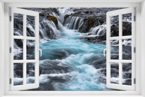 Fototapeta Naklejka Na Ścianę Okno 3D - Islanda, la terra dei vichinghi. La cascata Bruarfoss, con spuma di ghiaccio.