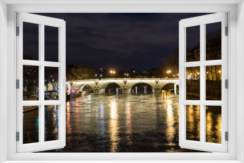 Fototapeta Naklejka Na Ścianę Okno 3D -  the bridge over the Seine was seen at night, beautifully illuminated