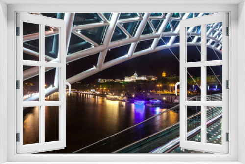 Fototapeta Naklejka Na Ścianę Okno 3D - Pedestrian bridge of peace over the Mtkvari (Kura) River in Tbilisi at night