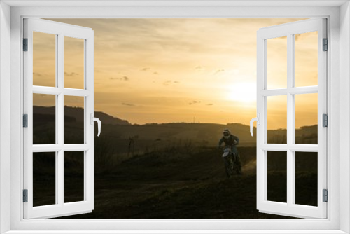 Fototapeta Naklejka Na Ścianę Okno 3D - Motorcyclist riding off road during sunset. Slovakia