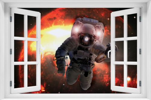 Fototapeta Naklejka Na Ścianę Okno 3D - Astronaut in outer space with cheseburger on the orange giant star background. Elements of this image furnished by NASA