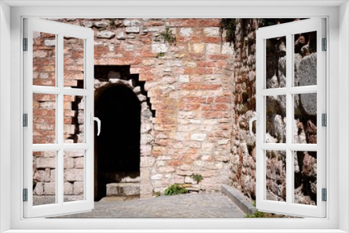 Fototapeta Naklejka Na Ścianę Okno 3D - Entrance of a Castle - Round arch and brick walls (Spello, Umbria, Italy)