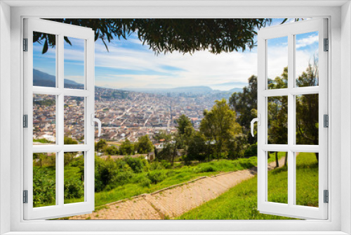 Fototapeta Naklejka Na Ścianę Okno 3D - Panorama of Quito seen from the Panecillo wood