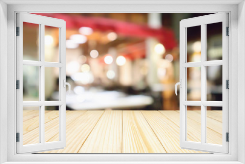 Wood table with Restaurant cafe or coffee shop interior with people abstract defocused blur background