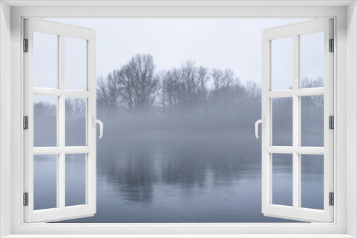 Fototapeta Naklejka Na Ścianę Okno 3D - Dramatic background of foggy weather at the lake