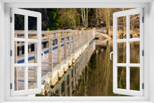 Fototapeta Naklejka Na Ścianę Okno 3D - Reflection of a foot bridge as seen in lake at gothenburg sweden