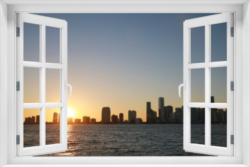 Fototapeta Naklejka Na Ścianę Okno 3D - City of Miami Skyline at Sunset in Key Biscayne Next to the Rickenbacher Causeway
