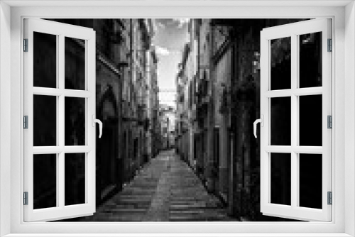 Fototapeta Naklejka Na Ścianę Okno 3D - Dark alley in sardinian old town