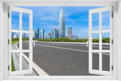 Fototapeta Naklejka Na Ścianę Okno 3D - empty urban road with modern skyline in the city