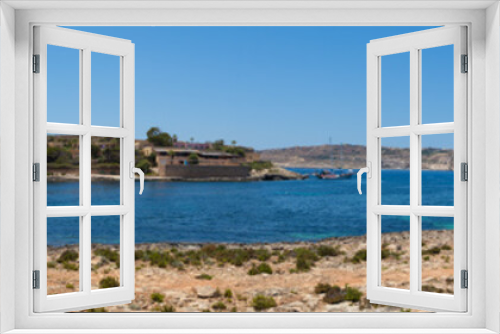 Fototapeta Naklejka Na Ścianę Okno 3D - High Resolution Panorama of the crystal clear blue waters of Santa Maria Beach in Santa Marija Bay, a large quiet bay on the small holiday island of Comino, Malta, June 2017