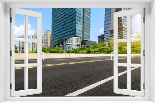 Fototapeta Naklejka Na Ścianę Okno 3D - empty asphalt road and modern commercial buildings