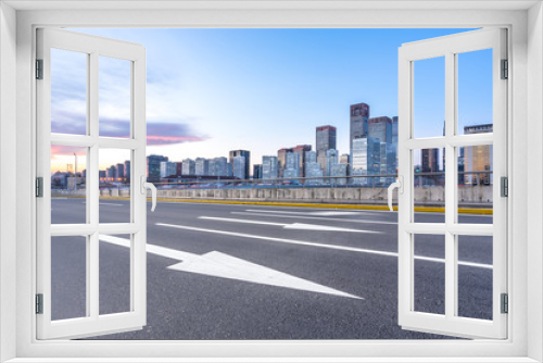 Fototapeta Naklejka Na Ścianę Okno 3D - empty asphalt road with city skyline