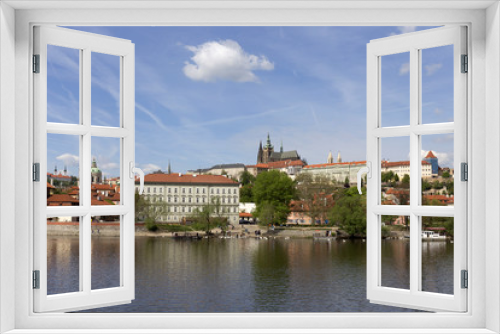 Fototapeta Naklejka Na Ścianę Okno 3D - Spring green Prague Lesser Town with gothic Castle above River Vltava in the sunny Day, Czech Republic
