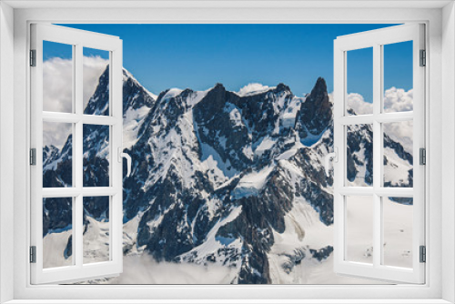 Fototapeta Naklejka Na Ścianę Okno 3D - Close-up of snowy peaks and mountains, viewed from the Aiguille du Midi, near Chamonix. A famous ski resort located in Haute-Savoie Province, at the foot of Mont Blanc in the French Alps.