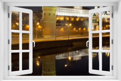 Panorama of the Moscow Kremlin with a mirror image in the Moscow river in the early morning, Russia
