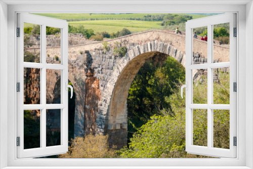 Fototapeta Naklejka Na Ścianę Okno 3D - bridge over the river Fiora near the castle of Vulci