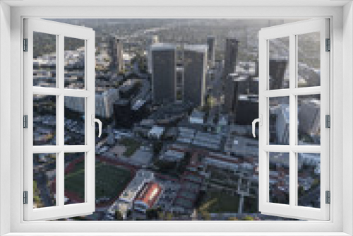 Fototapeta Naklejka Na Ścianę Okno 3D - Vertical aerial view of Beverly Hills homes and Century City towers in Los Angeles, California.  