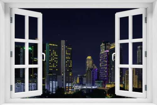Fototapeta Naklejka Na Ścianę Okno 3D - Cityscape at night in bangkok with tower and road, twilight sky