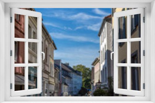 Fototapeta Naklejka Na Ścianę Okno 3D - Street, houses and sky