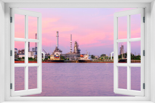 Fototapeta Naklejka Na Ścianę Okno 3D - Panorama view of Oil refinery at the river in sunset time