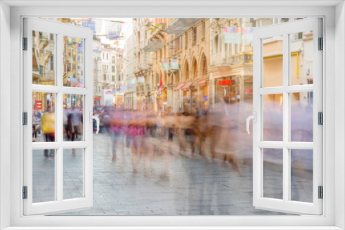 People walk at Istiklal street in Istanbul