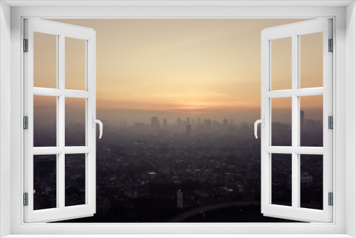 Fototapeta Naklejka Na Ścianę Okno 3D - Sunset Behind Jakarta's Skyline