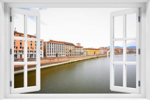 Fototapeta Naklejka Na Ścianę Okno 3D - Old residential architecture with river Arno in Pisa, Italy.