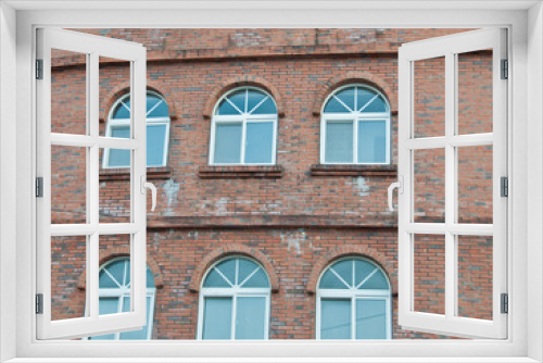 Fototapeta Naklejka Na Ścianę Okno 3D - Loft red bricks industrial wall and windows of an old factory