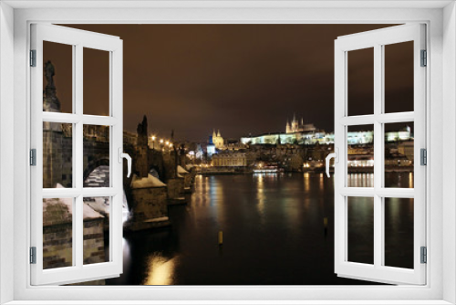 Snowy Prague Castle with Charles Bridge in the Night