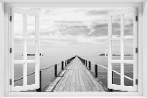 Fototapeta Naklejka Na Ścianę Okno 3D - Black and white Landscape of wooden bridge in blue sea on tropical beach .