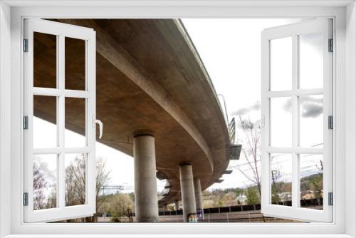Fototapeta Naklejka Na Ścianę Okno 3D - Under a Curved Train Bridge