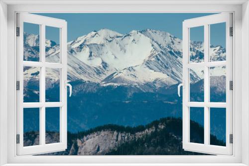 Fototapeta Naklejka Na Ścianę Okno 3D - Landscape of snow-capped peaks of the rocky mountains in Sunny weather. The concept of nature and travel.