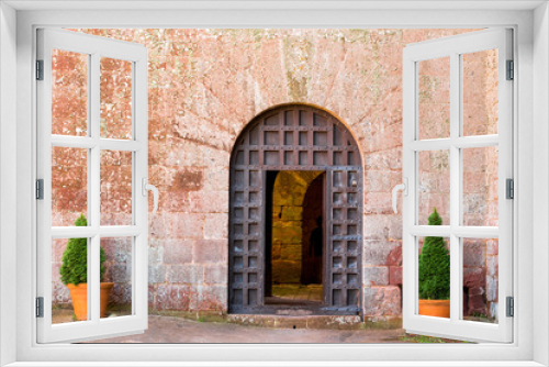 Fototapeta Naklejka Na Ścianę Okno 3D - View of the old iron door of the monastery Escornalbou in Tarragona, Spain. Copy space for text.