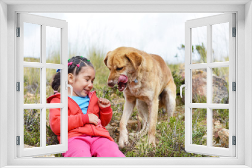 Fototapeta Naklejka Na Ścianę Okno 3D - Little latin girl with her big dog in the countryside.