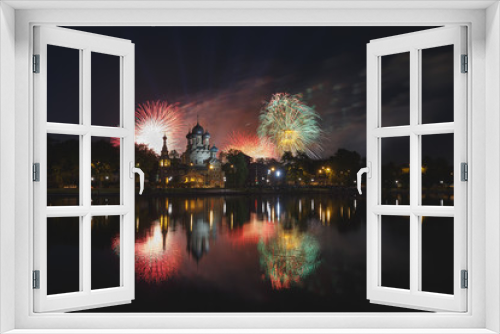 Fototapeta Naklejka Na Ścianę Okno 3D - Moscow, Russia. Church of the Holy Trinity in Ostankino. Festive fireworks in honor of Victory Day, 9 May. Flashes of salute are reflected in the smooth surface of the pond. Lanterns on the waterfront
