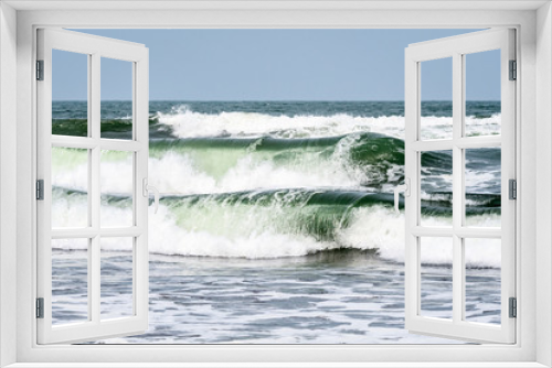 Fototapeta Naklejka Na Ścianę Okno 3D - Waves breaking on the Caribbean Sea with blue sky in the background, as a nature background
