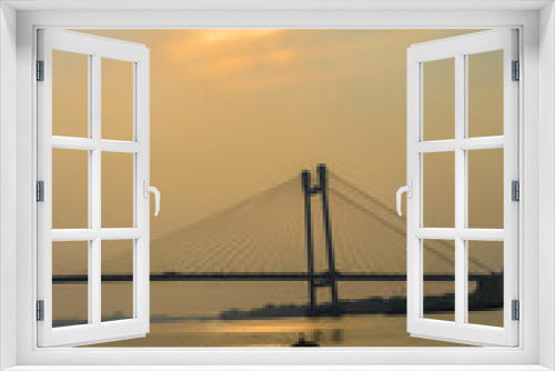 Fototapeta Naklejka Na Ścianę Okno 3D - View of second Hooghly Bridge Kolkata India taken at dusk, at dawn, at daytime in landscape style. The Subject of the image is, inspiration, exciting, hopeful, bright, sensational, tranquil, calm