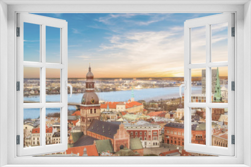 Fototapeta Naklejka Na Ścianę Okno 3D - Beautiful view of the old town and the steeple of the Dome Cathedral near the Daugava River in Riga, Latvia