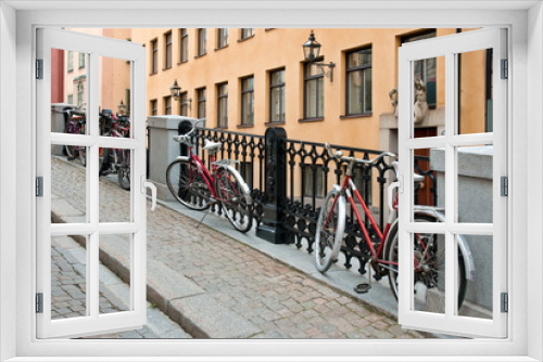 Fototapeta Naklejka Na Ścianę Okno 3D - Red bicycles in Gamla Stan (Old Town) in Stockholm, Sweden