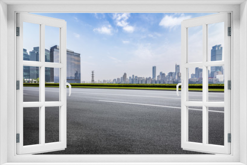 Fototapeta Naklejka Na Ścianę Okno 3D - Panoramic skyline and buildings with empty road