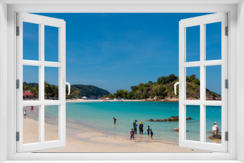 Fototapeta Naklejka Na Ścianę Okno 3D - Tourists, adults and children are enjoying their leisure time at the beautiful white sandy Long Beach (Pasir Panjang) with its crystal clear turquoise blue water on Redang Island, Malaysia.