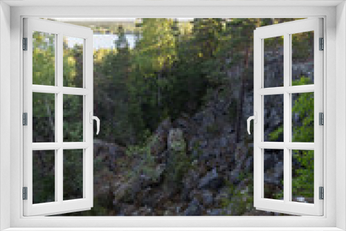 Fototapeta Naklejka Na Ścianę Okno 3D - Lake, lush forest, rocky hill and cliff viewed from the Pirunvuori (
