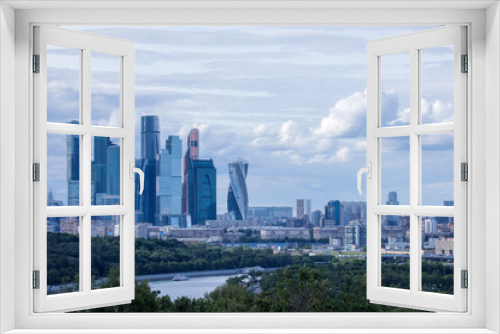 The panorama of Moscow, Russia wth Moskva city skyscrapers. The view from the observation platform of Sparrow Hills in the cloudy summer day
