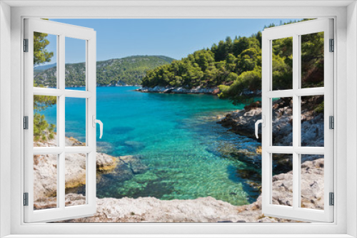 Fototapeta Naklejka Na Ścianę Okno 3D - Small lagoon with pine trees and rocks over crystal clear turquoise water near Cape Amarandos at Skopelos island, Greece
