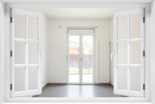 Empty room with window and totally white walls