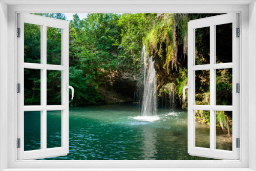 Fototapeta Naklejka Na Ścianę Okno 3D - Waterfall and a beautiful lagoon lake for relaxing in the summer forest.